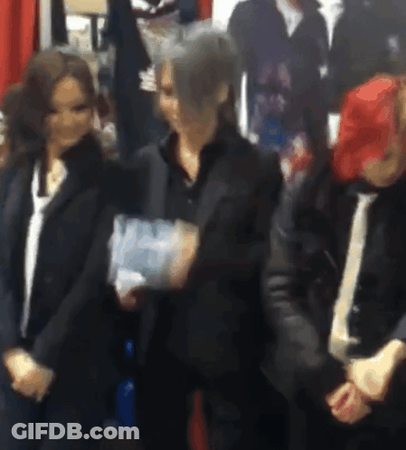 Group Of People Holding Hands In Room GIF