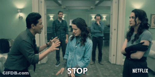 Group Of People Holding Stop Sign GIF