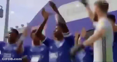 Group Of People Holding Trophy GIF