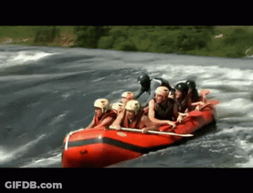 Group Of People In A Raft On A River GIF