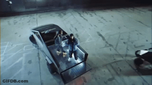 Group Of People In Back Of Tesla Truck GIF