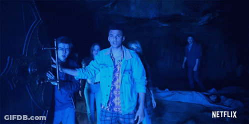 Group Of People In Dark Room With Netflix Logo GIF