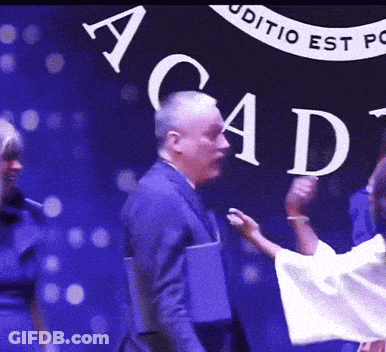 Group Of People In Front Of Acad Sign GIF