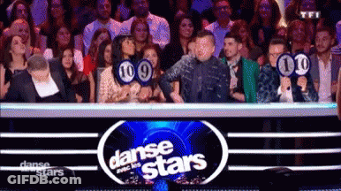 Group Of People In Front Of Dance Stars Sign GIF
