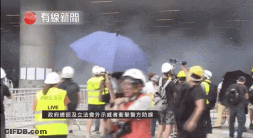 Group Of People In Front Of Live Sign GIF