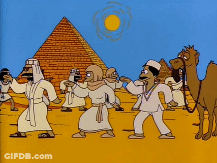Group Of People In Front Of Pyramid GIF