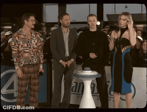 Group Of People In Front Of Sign Saying 4 GIF