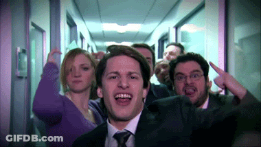 Group Of People In Hallway One Man Pointing Up GIF