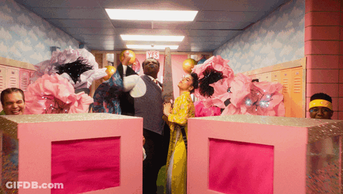 Group Of People In Hallway With Yes Sign GIF