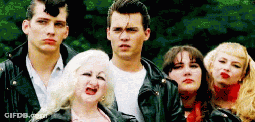 Group Of People In Leather Jackets Making Funny Faces GIF