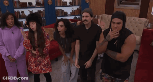 Group Of People In Living Room, One With Tattoo Saying I Love You GIF