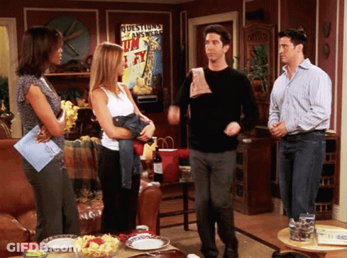Group Of People In Living Room With Questions Answered Poster GIF