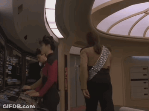 Group Of People In Room With Circular Ceiling GIF