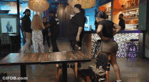 Group Of People In Room With Word Zeus GIF