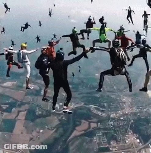 Group Of People Jumping Out Of Plane Saying Awesome GIF