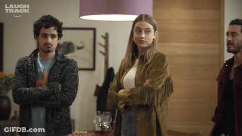 Group Of People Laughing In Room GIF