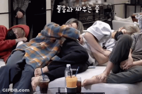 Group Of People Laying On Couch With Bottle Of Nana K GIF