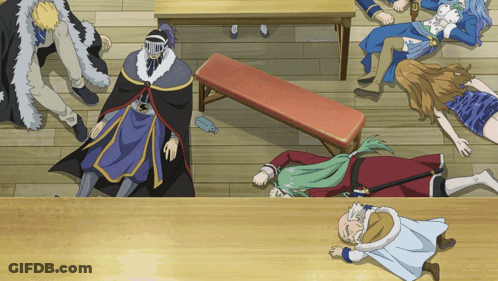 Group Of People Laying On Floor With Masked Man GIF