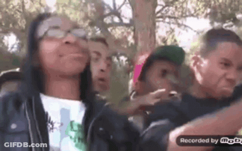 Group Of People Making Funny Faces In Park GIF
