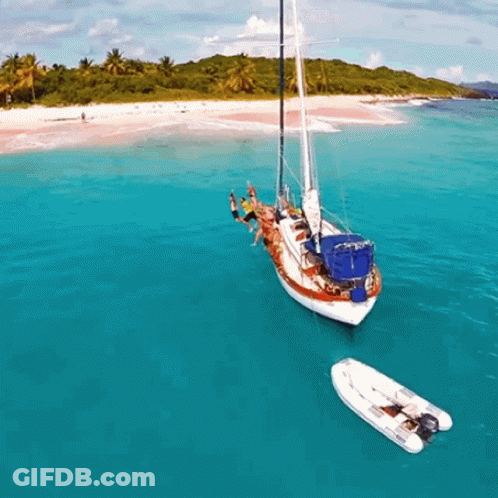 Group Of People On A Boat In The Ocean GIF