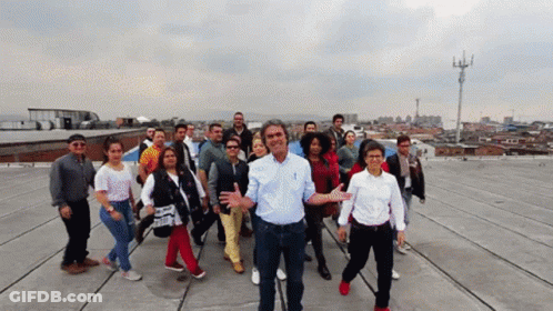 Group Of People On Roof One Man Thumbs Up GIF