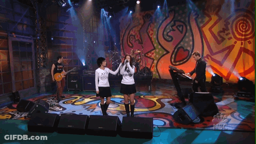 Group Of People On Stage With NBC Logo GIF
