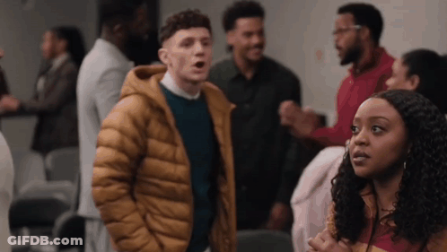 Group Of People One In Yellow Jacket GIF