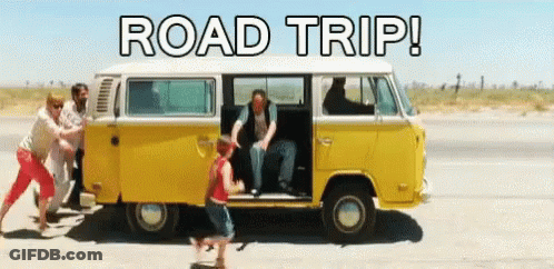 Group Of People Pushing Yellow Van Saying Road Trip GIF
