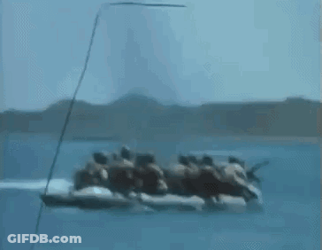 Group Of People Riding In A Boat On The Ocean GIF