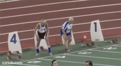 Group Of People Running On Track With Numbers 1-4 GIF