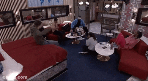 Group Of People Sitting Around Table GIF