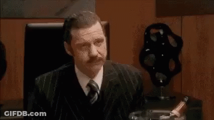 Group Of People Sitting Around Table Having Meeting GIF