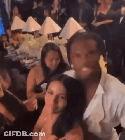 Group Of People Sitting At Tables GIF
