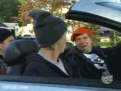 Group Of People Sitting In Car With Hat GIF