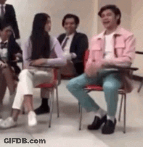Group Of People Sitting In Chairs Talking GIF