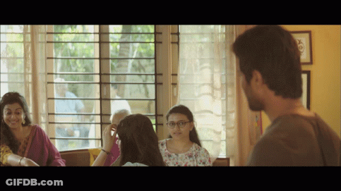 Group Of People Sitting In Front Of Window Talking GIF