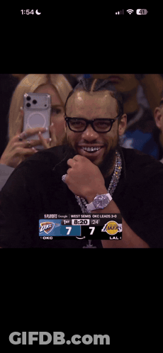 Group Of People Sitting In Stadium At 1:54 GIF