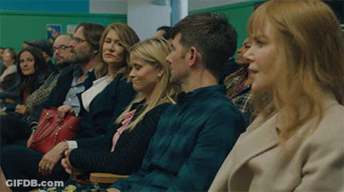 Group Of People Sitting In Waiting Room With Green Wall GIF