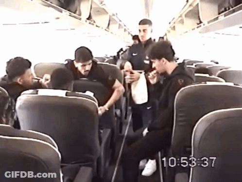 Group Of People Sitting On A Plane At 10:53 GIF