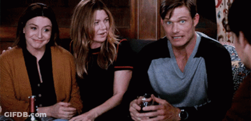 Group Of People Sitting On Couch With Bottles Of Wine GIF
