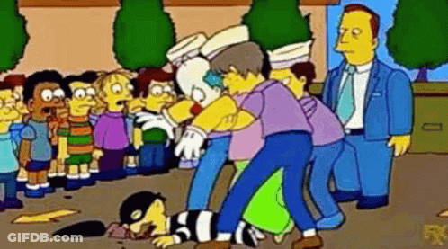 Group Of People Standing Around Clown GIF