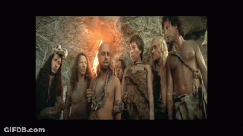 Group Of People Standing Around Fire GIF