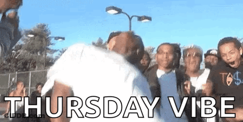 Group Of People Standing Around Man GIF