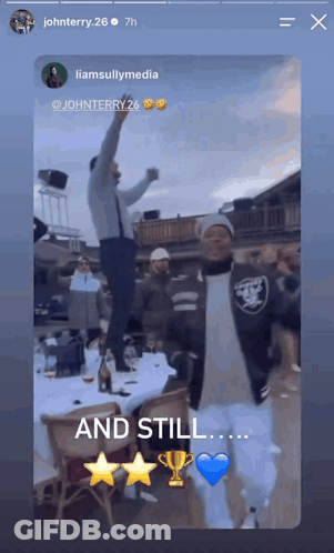 Group Of People Standing Around Table Saying And Still GIF
