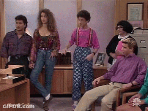 Group Of People Standing Around Woman GIF