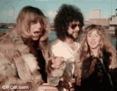 Group Of People Standing In Blurred Photo GIF
