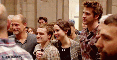 Group Of People Standing In Crowd GIF