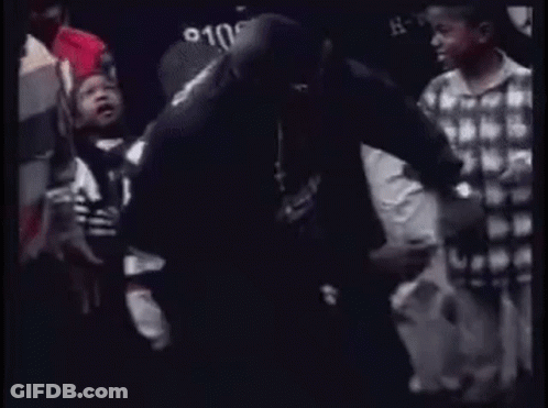 Group Of People Standing In Crowd Talking GIF