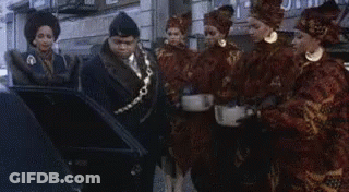 Group Of People Standing In Front Of Building GIF
