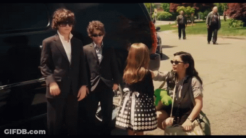 Group Of People Standing In Front Of Car GIF